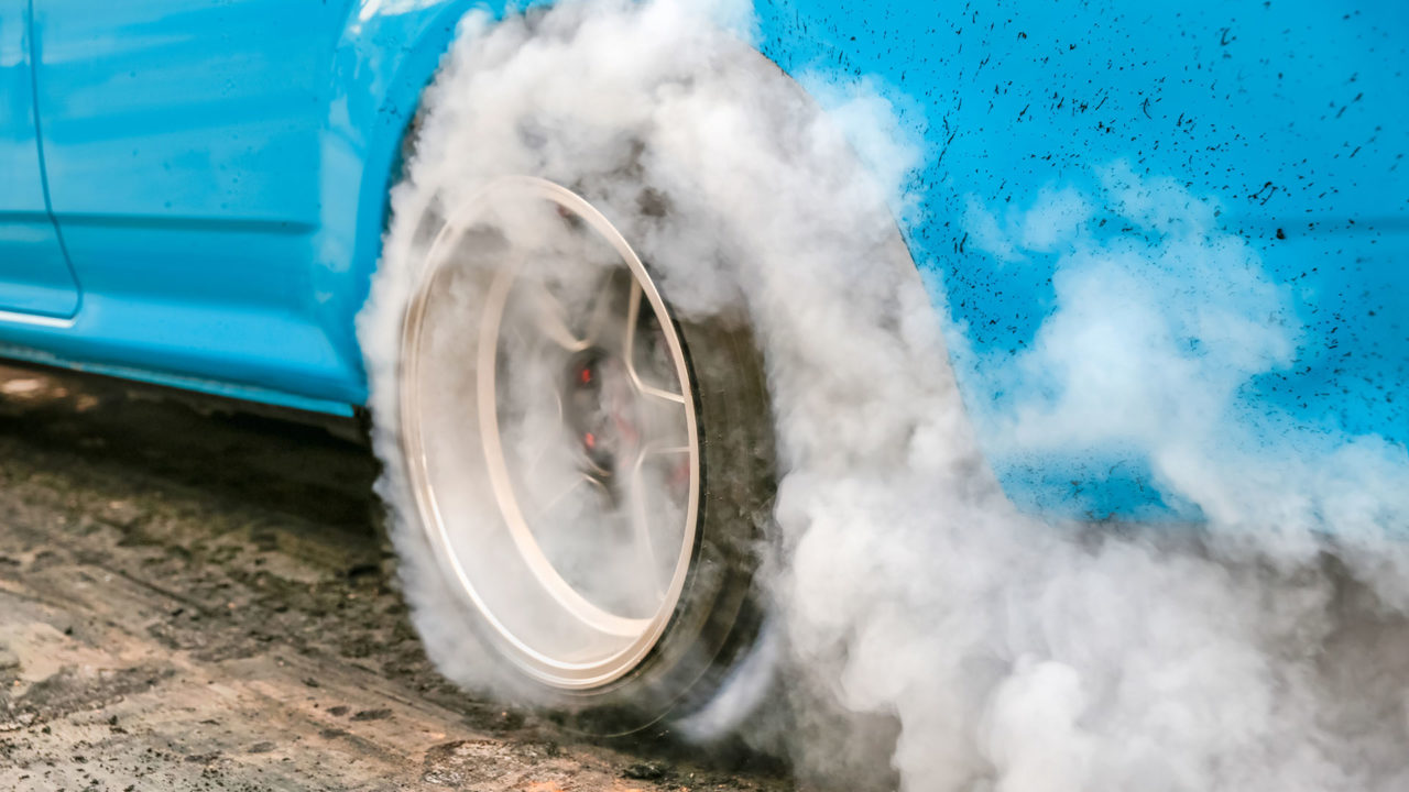 Car burning rubber on tires